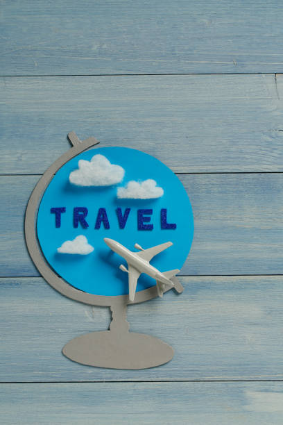 istock Globe travel concept with airplane. Wood background. 647273928