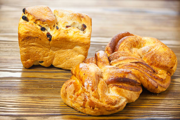 istock hot bread isolated on wooden background 647274228