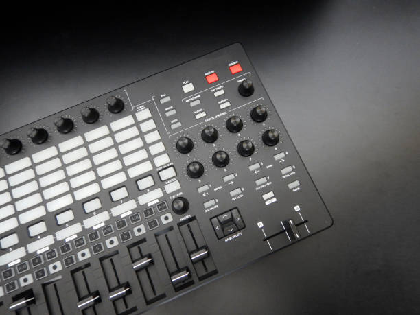 istock Electronic musical instrument or audio mixer or sound equalizer on a black background (analog modular synthesizer) 647278350