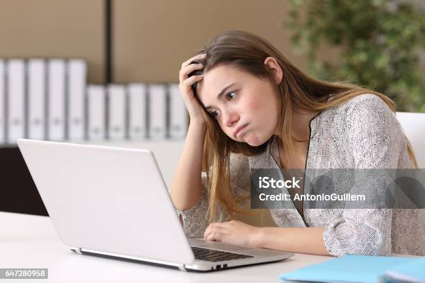 Frustrated Intern Working On Line At Office Stock Photo - Download Image Now - Occupation, Working, Confusion