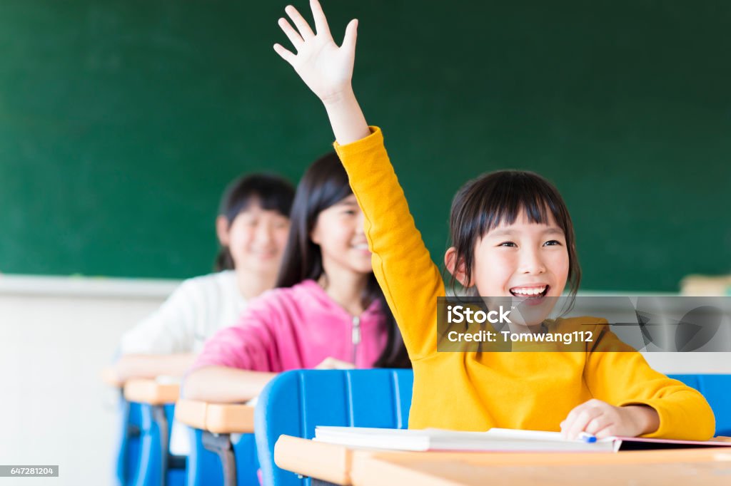 happy little girl learning in the classroom Child Stock Photo