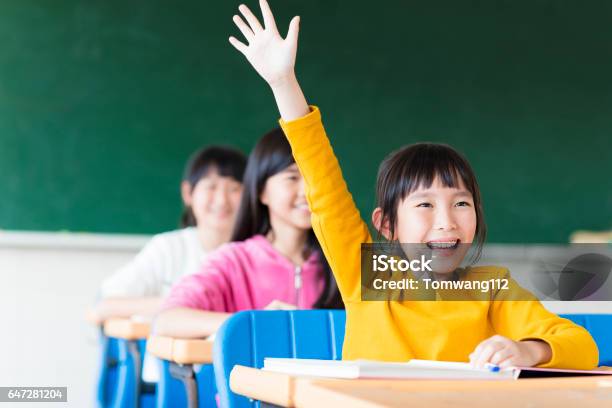 Happy Little Girl Learning In The Classroom Stock Photo - Download Image Now - Child, Learning, Classroom