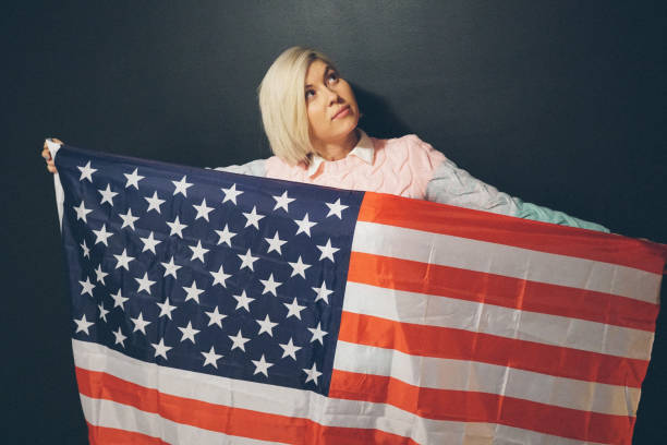 istock Blonde girl with USA flag 647287246