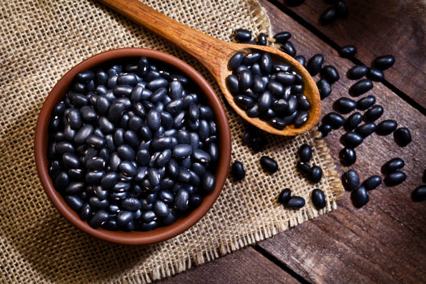Black beans in a bowl stock photo