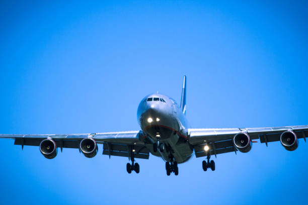 istock Jet airplane flying overhead close-up 647288674