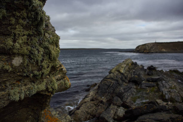 Dramatic view of stone beach and the stormy sea on remote island of Western Norway, Scandinavia