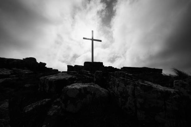The memorial at the top of mount harriet silhouetted In the sun