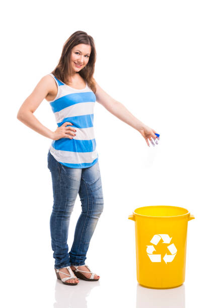 istock Beautiful young woman recycling 647301142