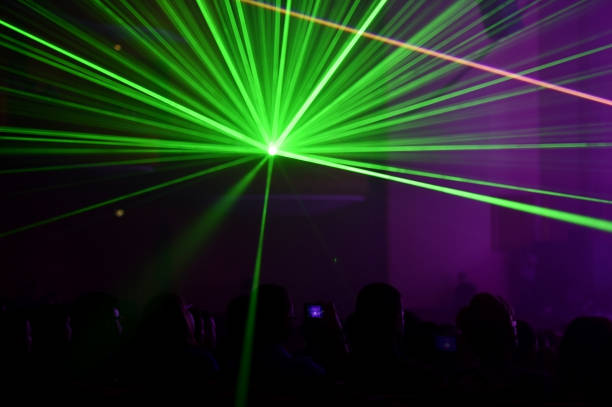 istock People watching a beautiful laser show 647302176
