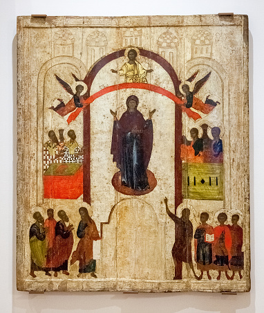 VELIKY NOVGOROD, RUSSIA - JULY 24, 2014: Antique Russian orthodox icon. The Protection of the Virgin painted on wooden board. Late 14th century