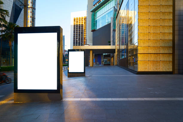 istock Two blank advertising stand at early morning against office building. 647308368
