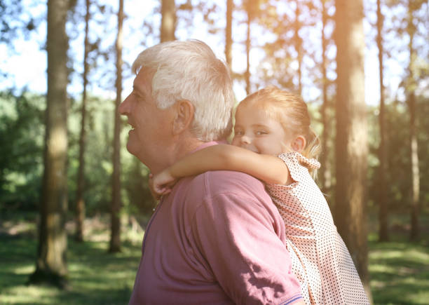 istock Granddaughter enjoying piggyback ride. 647308870