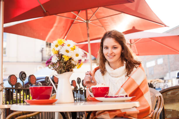 istock Woman in cafe outdoor 647309112