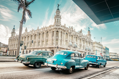 old blue american car in front of Gran Teatro of Havanna