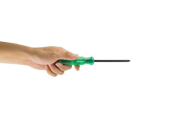 istock Hand holding a screwdriver isolated on white background. 647312784