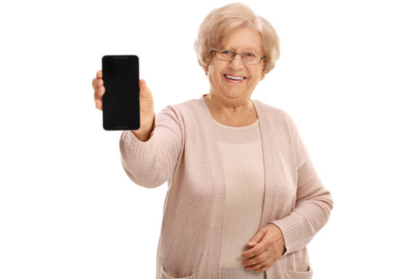 istock Joyful mature lady showing a phone 647315158