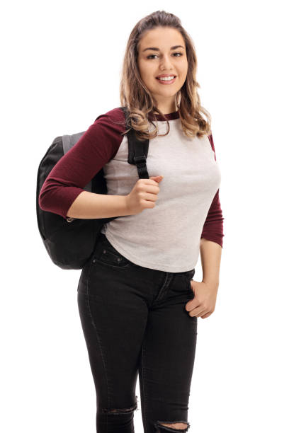 istock Happy young woman with a backpack looking at the camera 647317242