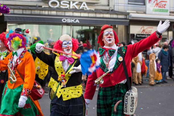 The Carnival of Basel (Basler Fasnacht) is the biggest carnival in Switzerland and takes place every year between February and March in Basel. The image shows seveal Participants of the carnival parade with musical instruments.