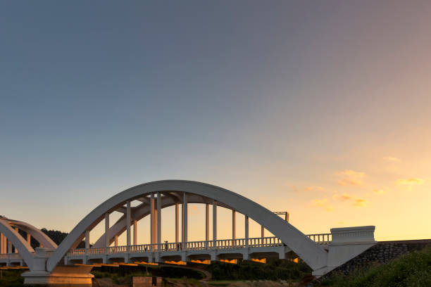 istock white bridge and sunset sky in Lamphun 647321824