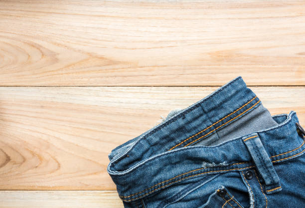 istock jeans on wooden backgrounds 647322100