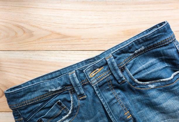 istock jeans on wooden backgrounds 647322288