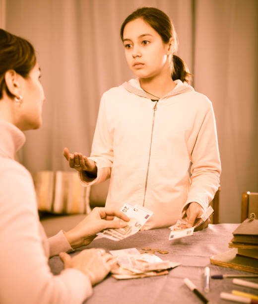 istock Daughter asks cash from mother 647324460