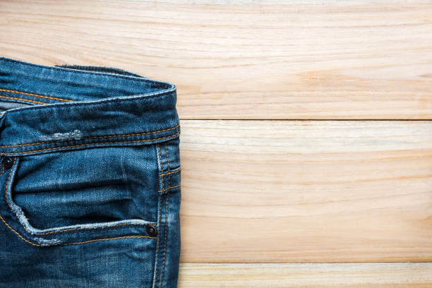 istock jeans on wooden backgrounds 647324480
