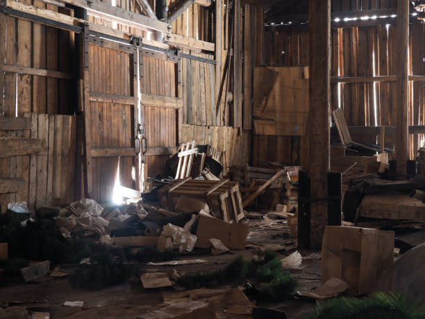 istock Rubbish, garbage in an old wooden barn. Rays of light 647324830