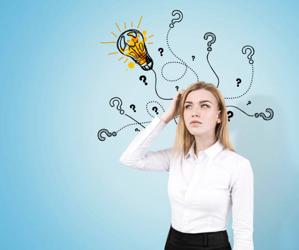 istock Woman scratches head, light bulb and questions 647333192
