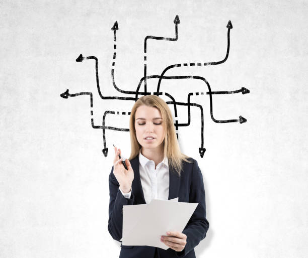 istock Blond woman with documents and arrow sketch 647338204