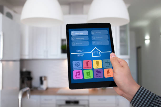 istock male hand holding tablet app smart home kitchen in house 647343286
