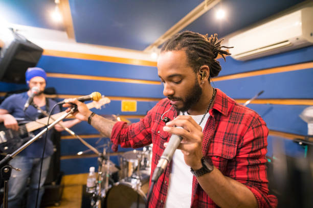 istock Music band rehearsing in studio 647344592