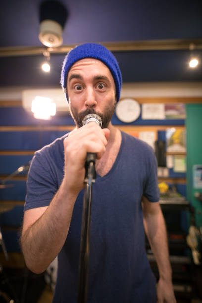 istock Music band rehearsing in studio 647344604