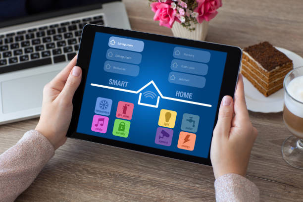 istock woman hands holding tablet computer with app smart home 647344712