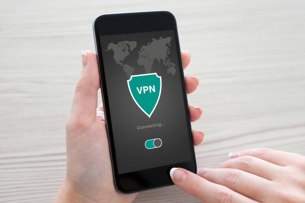 istock woman holding phone app vpn creation Internet protocols protection network 647345336