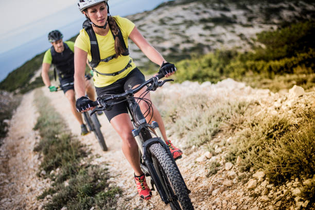 istock Couple cycling at trail 647345364