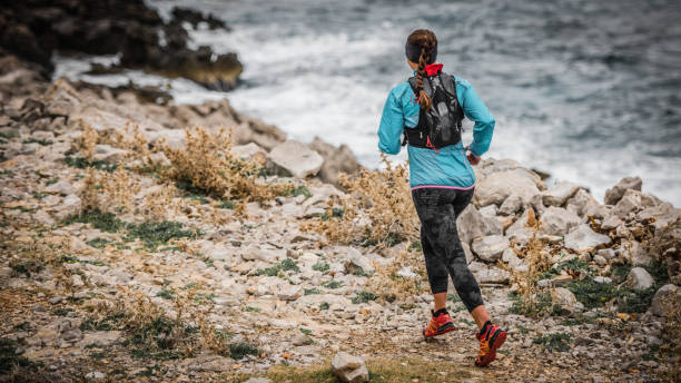 istock Woman running on trail 647345396
