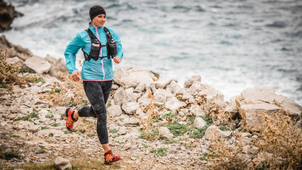 istock Woman running on trail 647345414
