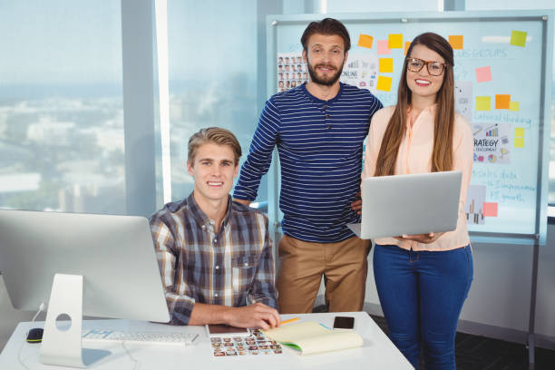 istock Portrait of smiling graphic designers 647348036