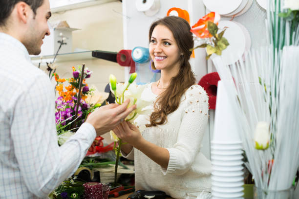 istock seller helping to pick flowers man 647348920