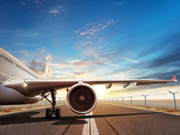 istock Close-up of airplane on runway in sunset light 647348980