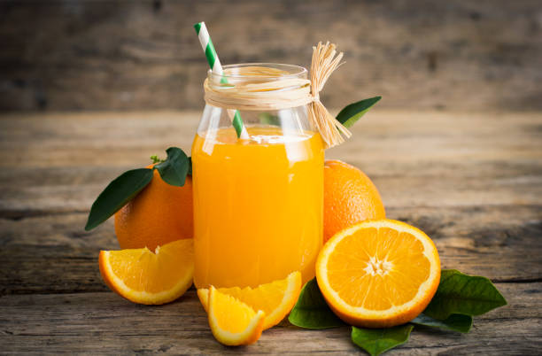 istock Fresh orange juice in the glass jar 647355482