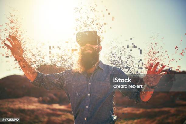 Bearded Guy In Desert Wearing Vr Glasses Stock Photo - Download Image Now - Sensory Perception, Virtual Reality, Virtual Reality Simulator