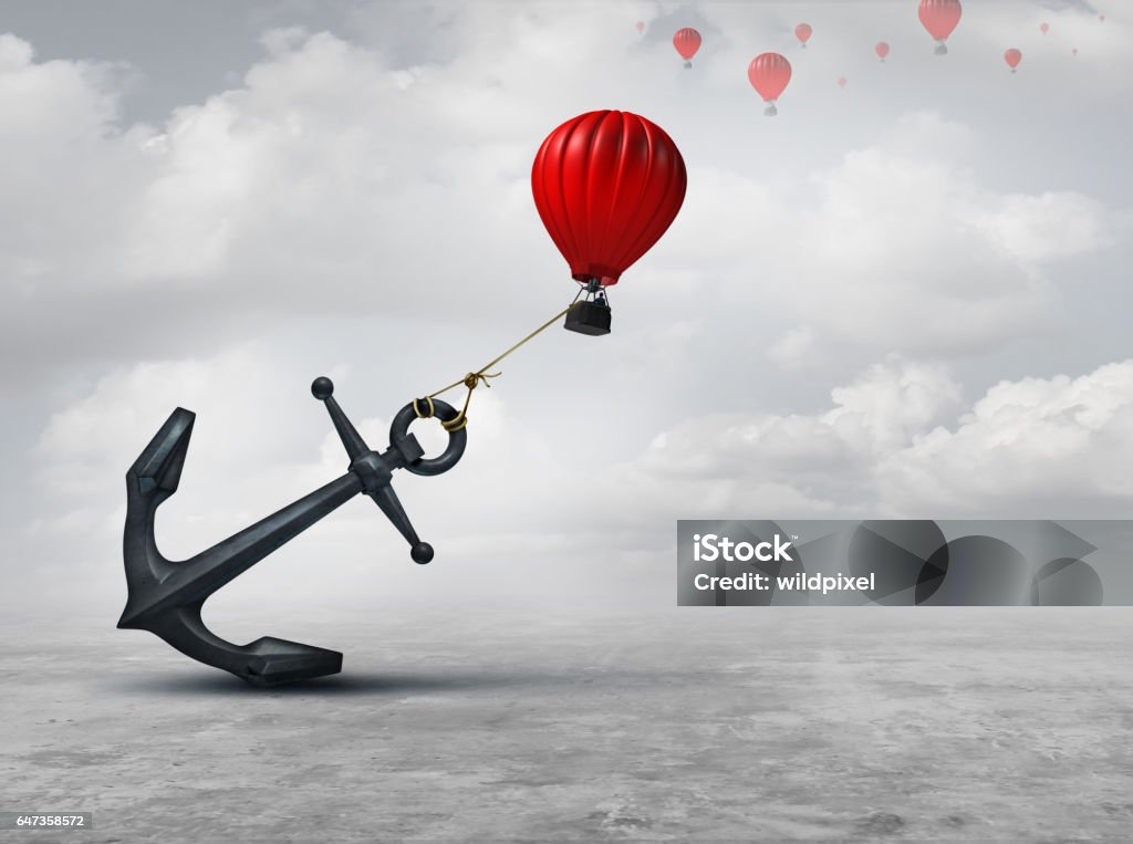 Held Back Held back metaphor as a large anchor holding or oppressing an air balloon and restricting movement as a suppression business metaphor  from aspiring to succeed with 3D illustration elements. Adversity Stock Photo