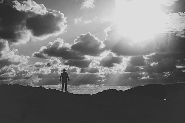 istock Full Length Of Man Standing On Mountain Against Cloudy Sky 647360221