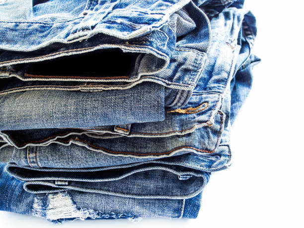 istock Pile of blue jeans, fabric texture 647361262