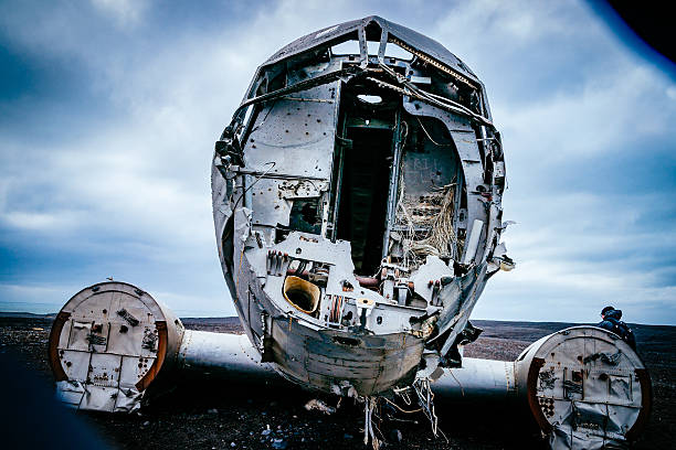 istock Abandoned Military Airplane At Beach Against Cloudy Sky During Winter 647362431