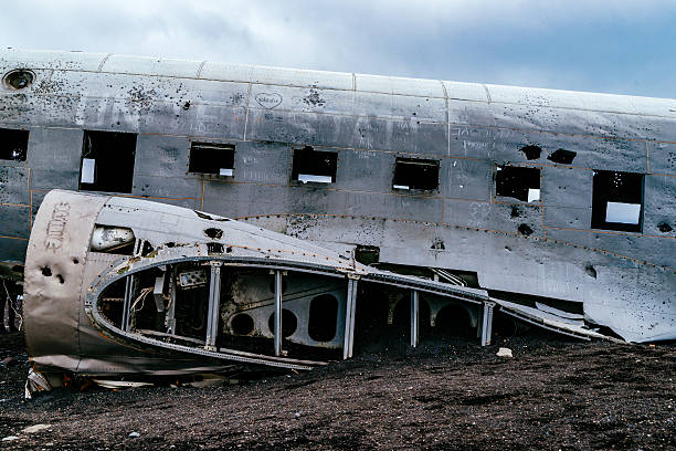 istock Abandoned Military Airplane At Beach Against Cloudy Sky During Winter 647362483