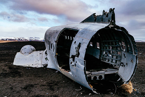 istock Abandoned Military Airplane At Beach Against Cloudy Sky During Winter 647362485
