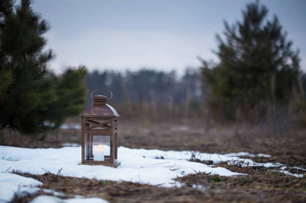 istock Wooden lantern with a candle. 647362574
